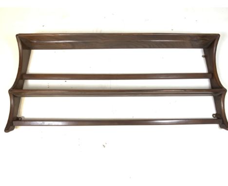 An Ercol plate rack with label verso, W:97cm x H:50cm