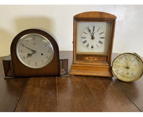 A Smiths Enfield early 20th century mantle clock also with an inlaid mantle clock and a brass aneroid barometer Kensington. (