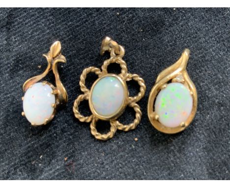 Three opal pendants set in 9ct gold. Total weight 5gm. Opals approx 9mm