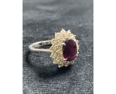 18ct white gold ruby and diamond ring. Total weight 3 gm. Ring size L. Size of ruby 8mm x 6mm
