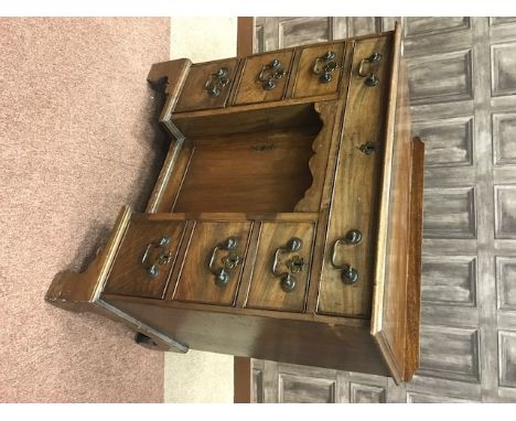 LATE GEORGE III MAHOGANY KNEEHOLE WRITING DESKthe long frieze drawer with central recessed cupboard below, flanked by three d