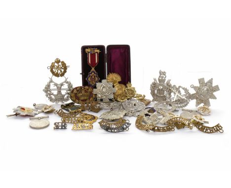 LOT OF MILITARY CAP BADGES AND SHOULDER TITLESincluding Argyll and Sutherland Highlanders, Glengarry badge for The Royal Scot