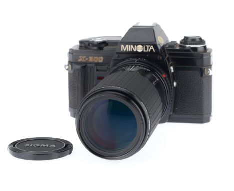 A Minolta X-300 35mm SLR Camera, black, serial number 9384369, body G, light usage marks, shutter works, viewfinder LEDs work