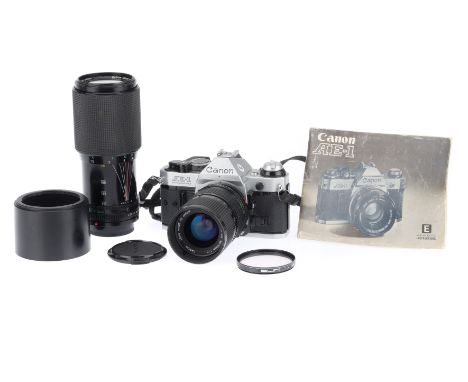 A Canon AE-1 35mm SLR Camera Outfit, silver, serial number 4412542, body G-VG, shutter works, meter responds to light, with a