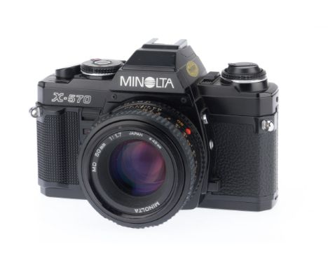 A Minolta X-570 35mm SLR Camera, black, serial number 9065595, body VG, shutter works, viewfinder LEDs work, responds to ligh