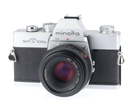 A Minolta SRT100b 35mm SLR Camera, silver, serial number 8320129, body G-VG, shutter works, advance works, not able to test m