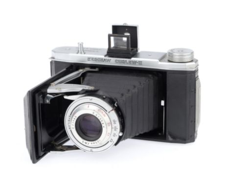 A Kershaw Curlew II Folding Medium Format Camera, black, serial number 3/8907, body G, one corner of lifting leatherette, shu