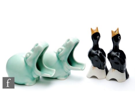 Clarice Cliff - Mr Hippo - A pair of later pipe rests or ashtrays, each modelled as an open mouth hippo decorated in a Jade g