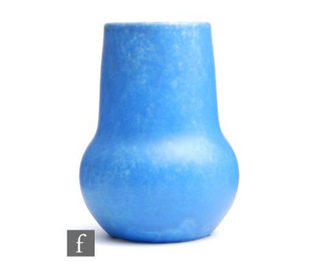 Ruskin Pottery - A vase of globe and shaft form decorated in an all over mottled blue, impressed mark alongside&nbsp;incised 