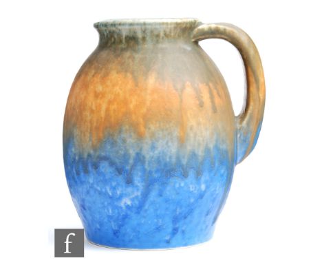 Ruskin Pottery - A crystalline glazed flower jug decorated in a streaked and dribble green to orange to blue, impressed mark 