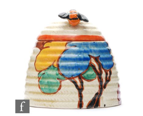 Clarice Cliff - Blue Autumn - A large Beehive honey pot circa 1930, hand painted with a stylised tree and cottage landscape, 
