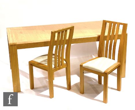 Ercol Furniture - A light oak Bosco range extending rectangular dining table and six chairs with cream fabric upholstered sea