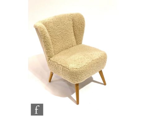 Heals - A contemporary Ziggy occasional chair, upholstered in sheep's wool above splayed and tapered light oak legs, labelled