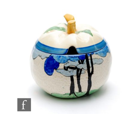 Clarice Cliff - Blue Firs - An apple shaped preserve and cover circa 1932, hand painted with a stylised tree lined coastal sc