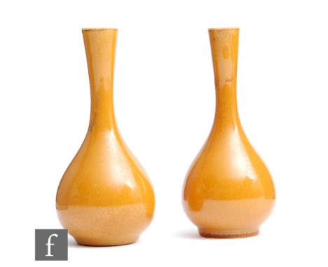 Linthorpe Pottery - A pair of small late 19th to early 20th Century shape 849 vases decorated in an all over mustard yellow w