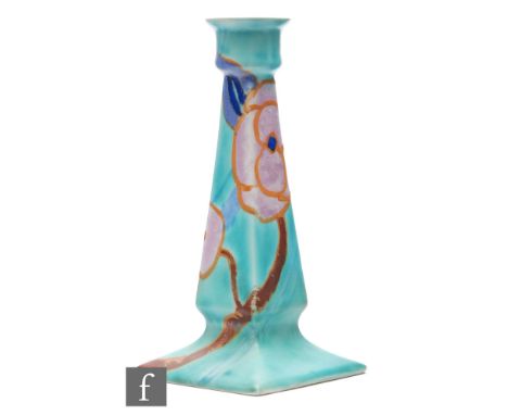 Clarice Cliff - Inspiration Rose - A candlestick of footed tapered square section circa 1930, hand painted with a stylised fl