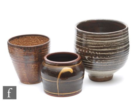 David Leach - A studio pottery stoneware footed bowl of ovoid form, decorated with bands of brown over grey, impressed mark, 