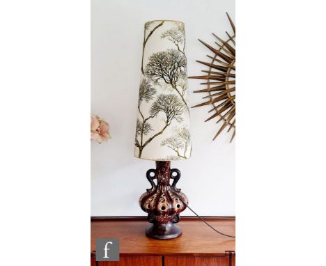 Herda - A West German 'Fat Lava' lamp of swollen baluster form with a pierced body and scroll loop handles, decorated in a ru