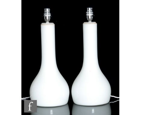 Iittala - A pair of glass table lamps, each of globe and shaft form, opal cased in clear, height including fittings 42cm. (2)