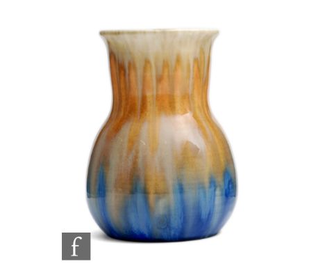 Ruskin Pottery - A small crystalline glaze vase of globe and shaft form decorated in a streaked yellow to orange to blue,&nbs