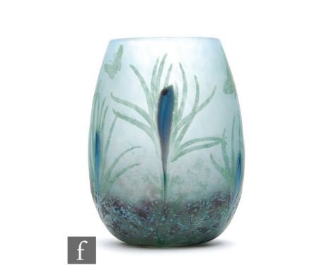 Daum - An early 20th Century cameo glass vase of swollen sleeve form, cased and cut with butterflies and flowers over a mottl