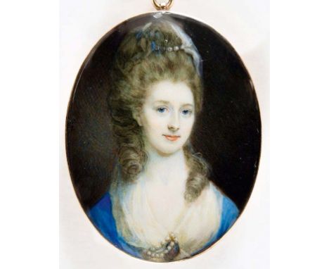 ATTRIBUTED TO JOSEPH SAUNDERS (F.1772-1811) Portrait of Annie Griffiths wearing a blue dress with pearls and a miniature at h