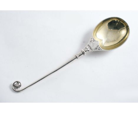 A VICTORIAN "GOTHIC STYLE" FRUIT SERVING SPOON The stem & terminal resembling a Bishop's crozier, with pierced fleur-de-lys a