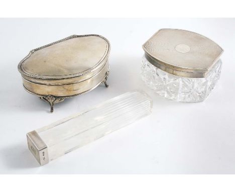 A DRESSING TABLE BOX with a curved front, engine-turned cover and four legs by Synyer & Beddoes, Birmingham 1918 (lined & loa