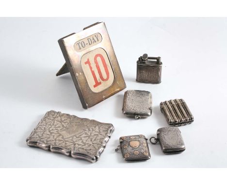 A MIXED LOT:- Four various vesta cases, a "Mayfair" cigarette lighter (metal innards), an Edwardian small calendar frame  by 