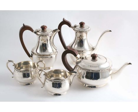 A MODERN FIVE-PIECE TEA & COFFEE SERVICE The plain circular bodies decorated with applied "Celtic" borders, by J.B. Chatterly