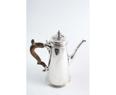 AN EARLY GEORGE II CHOCOLATE POT  of plain tapering form with a moulded base & leaf capped tapering octagonal spout, the cush