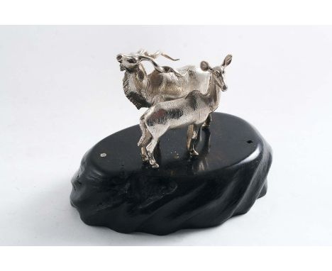 A CONTEMPORARY SOUTH AFRICAN MINIATURE SCULPTED GROUP OF A BUCK & DOE KUDU on an ebony base, by Patrick Mavros of Zimbabwe, c
