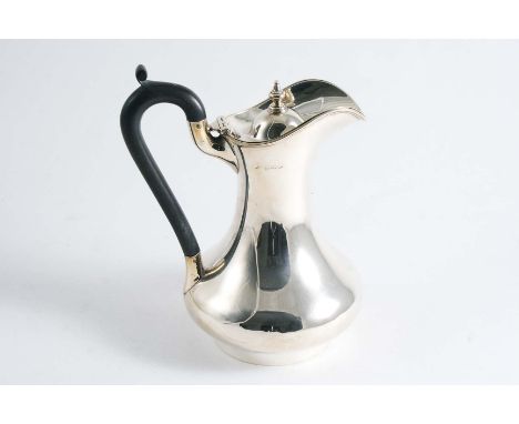 A BALUSTER HOT WATER JUG with a collet foot & knop finial, by Horace Woodward & Co., Birmingham 1918;  7.5"  (19 cms) high;  