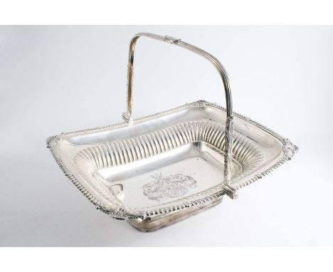 BY PAUL STORR:- A George III swing handled basket of rounded rectangular form with part-fluting and a gadrooned rim with foli