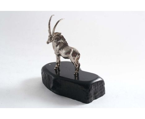 A CONTEMPORARY SOUTH AFRICAN MINIATURE SCULPTED FIGURE OF A BUCK SABLE ANTELOPE on an ebony base, by Patrick Mavros of Zimbab