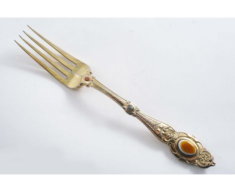 A VERY RARE VICTORIAN SILVERGILT TABLE FORK in ornamental Elizabethan pattern, further embellished with oval agate bosses*, b
