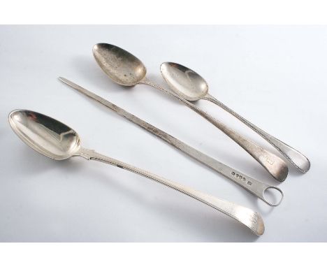 A GEORGE III FEATHER-EDGE BASTING SPOON  (with shoulders) initialled "W" by George Smith, London 1789, a meat skewer, initial
