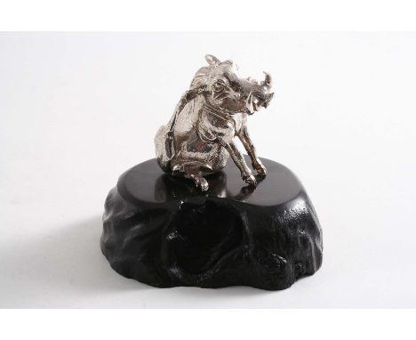 A CONTEMPORARY SOUTH AFRICAN MINIATURE SCULPTED FIGURE OF A WARTHOG, scratching itself, on a carved ebony base, by Patrick Ma