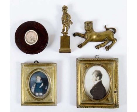 ENGLISH SCHOOL EARLY 19TH CENTURY Portrait of a child wearing blue dress and standing with toy horse and a cat, on ivory or c