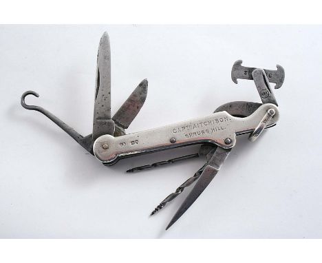 A VICTORIAN MOUNTED STEEL MULTI-TOOL with eight functions (including a grip for extracting twelve and sixteen bore shotgun ca