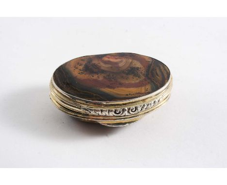 A MID 18TH CENTURY SILVERGILT-MOUNTED HARDSTONE SNUFF BOX  of shaped oval outline with reeded borders and a chased foliate th