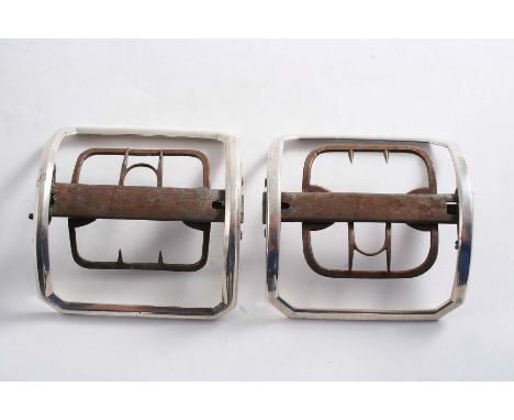 TWO SIMILAR GEORGE III LARGE MOUNTED STEEL SHOE BUCKLES of plain canted rectangular outline, each with a button-operated quic
