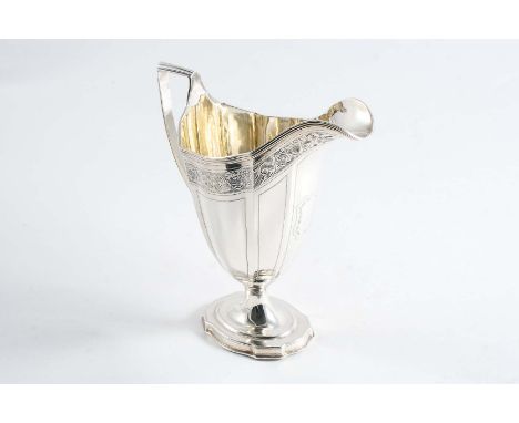 A HELMET CREAM JUG with bright-engraving, reeded borders and a vacant cartouche, gilt interior, by G. Nathan & R. Hayes, Ches