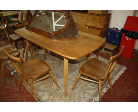 An Ercol elm dining room suite to include a sideboard, dining table and set of six spindle back dining chairs  