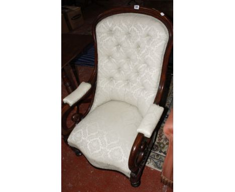 A Victorian mahogany framed button back open armchair, on turned legs, with upholstered seat, back and arms 