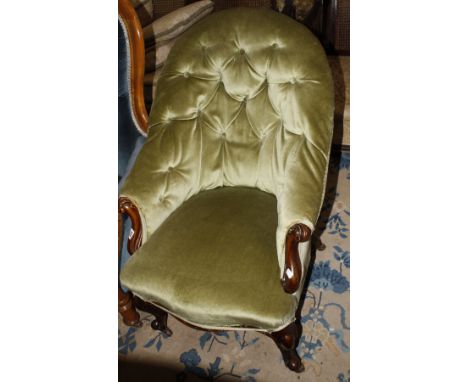 A Victorian mahogany framed button back easy chair on cabriole legs 