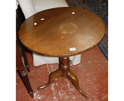 An early 19th century oak snap top tripod table.  