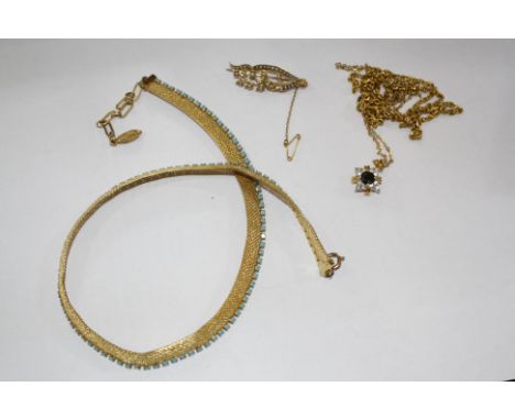 A 15ct gold and seed pearl brooch, foliate shaped, a gold coloured chain a gold coloured chain with star shaped pendant and a