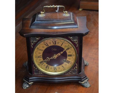 An Odo bracket style mantel clock, brass dial, twin winding holes, Roman and Arabic numerals, striking, key 