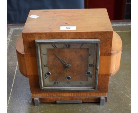 An Art Deco walnut mantel clock, 13cm square silvered dial, bold Roman numerals, minute track, 23.5cm high overall